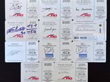 a lot of business cards with autographs on them