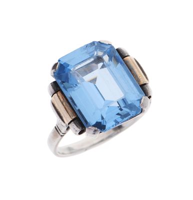 an image of a ring with a blue topazt stone