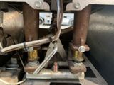 a close up view of a machine with a lot of pipes