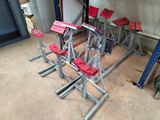 many red stools sitting on the floor in a room