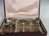a box with silverware inside of it on a table