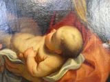 un tableau représentant un bébé endormi sur une couverture