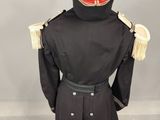 an image of a military uniform with a red hat and red gloves