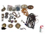 a lot of jewelry that is on the table
