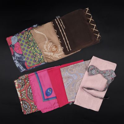 several different colored handkerchiefs laid out on a black surface