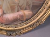 a picture of a painting of a woman in a gold frame