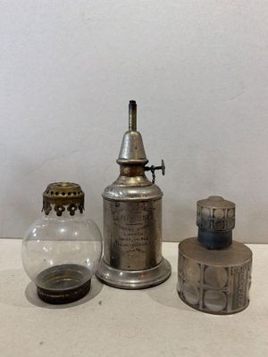 several different types of glass bottles are lined up on a table