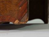 a wooden box with a handle on top of a table