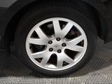 a close up of a tire on a car ' s rim