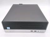 a close up of a desktop computer on a white surface