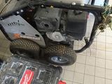 a lawn mower that is sitting on the ground