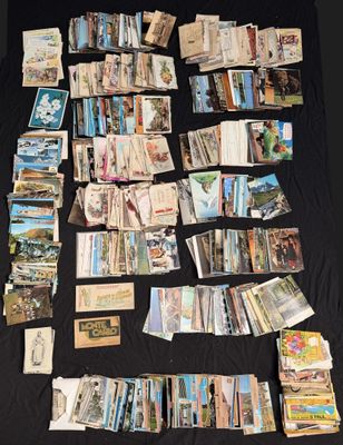 many cards laid out on a table with a black background