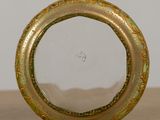 a picture of a gold and green picture frame on a table