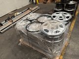 a lot of wheels on a pallet in a warehouse