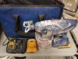a bag of tools sitting on a table next to a bag of tools
