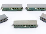 several toy train cars are arranged in a circle on a white surface