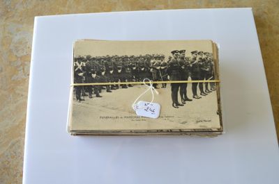 an old photo of a group of men standing in front of a crowd of people