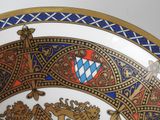 a decorative plate with a coat of arms on it