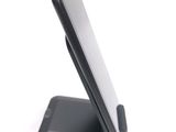 a cell phone that is sitting on top of a stand
