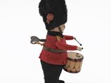 a figurine of a toy soldier with a drum