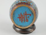 a blue and gold vase with the word faith written on it