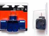 two plugs in a package on a white surface