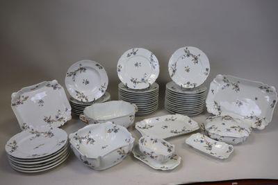 a lot of plates and bowls sitting on a table