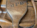 a brown bag that has a handle on it