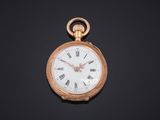 an antique pocket watch with roman numerals on a black background