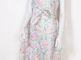 a mannequin wearing a dress with a floral pattern on it