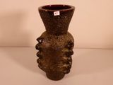 a brown vase that is sitting on a table