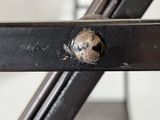 a close up of a piece of metal with a hole in it