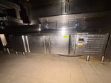 an image of a commercial kitchen with a lot of counter space
