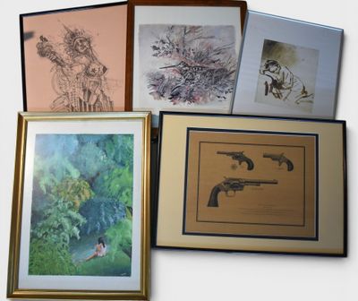 a lot of framed art on the wall of this room