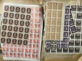 two boxes of stamps on top of each other on a table