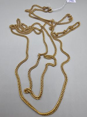 a gold chain with a knot on it