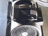 an image of a blow dryer sitting on a wooden floor