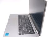 a silver laptop with a blue sticker on the screen