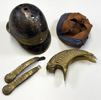 a helmet, knife, and other items that are on a table