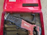 a red tool case with tools in it on the floor