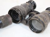two binoculars that are sitting on a table