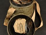 a small metal container with some coins in it