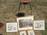 a picture of a painting on a tripod in the grass