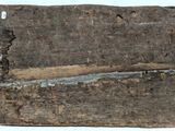 an image of a piece of wood that has been cut in half and is sitting on a white surface