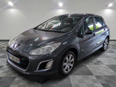 a picture of a grey car parked in a garage