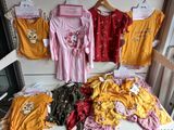 a lot of clothes that are on display in a store