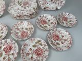 many plates and bowls that are sitting on a table
