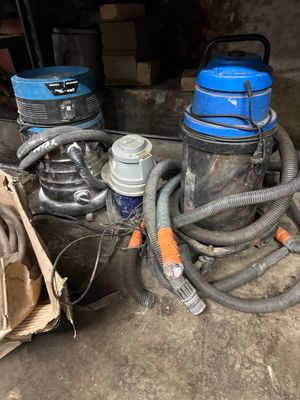 two vacuums that are sitting next to each other on the floor