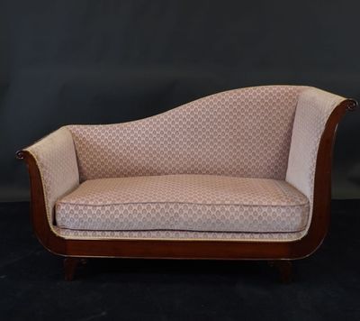 an image of a couch that is sitting on a black surface