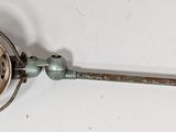 a small metal object that is on a white surface